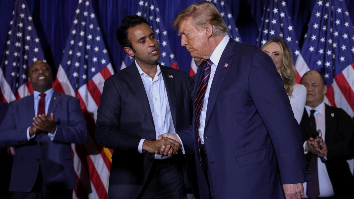 PHOTO: Republican presidential candidate and former President Donald Trump shakes hands with former Republican presidential candidate Vivek Ramaswamy during his New Hampshire presidential primary watch party, in Nashua, New Hampshire, Jan. 23, 2024.  (Mike Segar/Reuters)