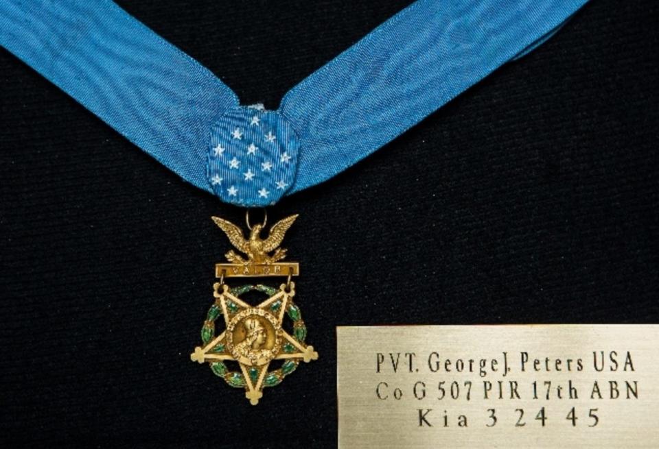 A Medal of Honor of unknown origin, credited to World War II paratrooper George J. Peters of Cranston, is on display at an American Legion post in Las Vegas.