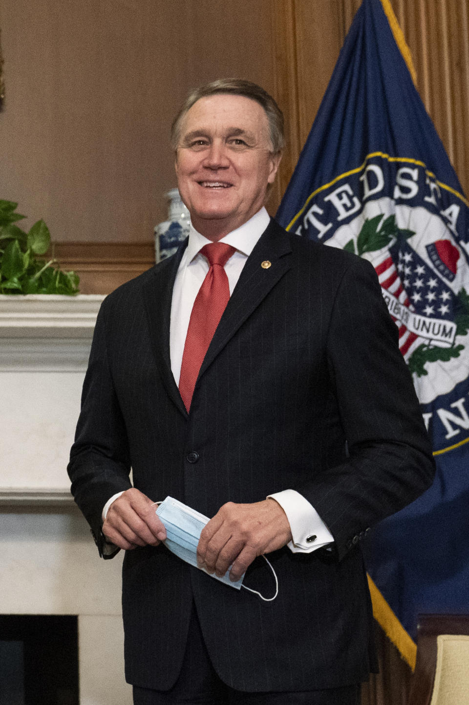 FILE - Sen. David Perdue, R-Ga., is shown on Capitol Hill, Wednesday, Sept. 30, 2020, in Washington. Perdue will challenge Gov. Kemp for governor, he announced Monday, Dec, 6, 2021 setting up a bitter 2022 Republican primary fight while Democrat Stacey Abrams is likely to await the winner. (AP Photo/Manuel Balce Ceneta, POOL)