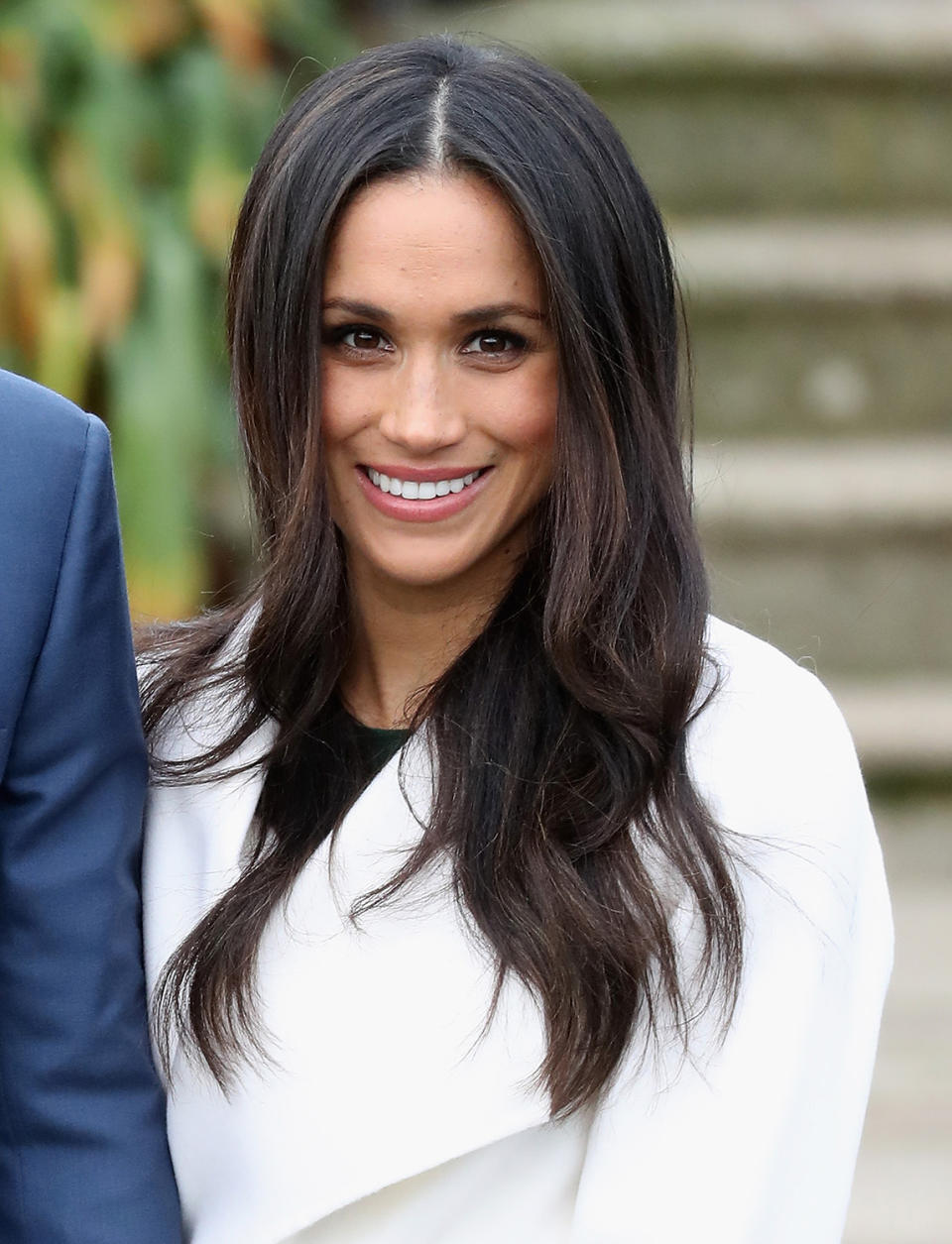 <p>At the official photo call to announce her engagement to Prince Harry, the 36-year-old smiled joyfully wearing long, luxurious layers. (Photo: Chris Jackson/Getty Images) </p>