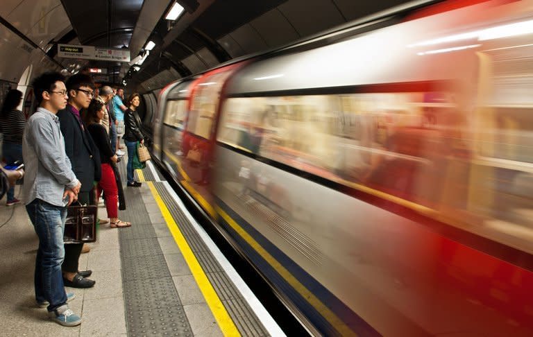 Passengers wait for a London underground train at London Bridge Station on July 30, 2012. The London Underground began celebrating its 150th birthday on Wednesday, creaking under the demand of four million daily passengers as it looked back to the opening of the world's first underground railway in 1863