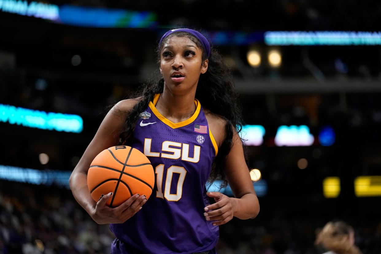 Angel Reese holds the ball during the national championship game.