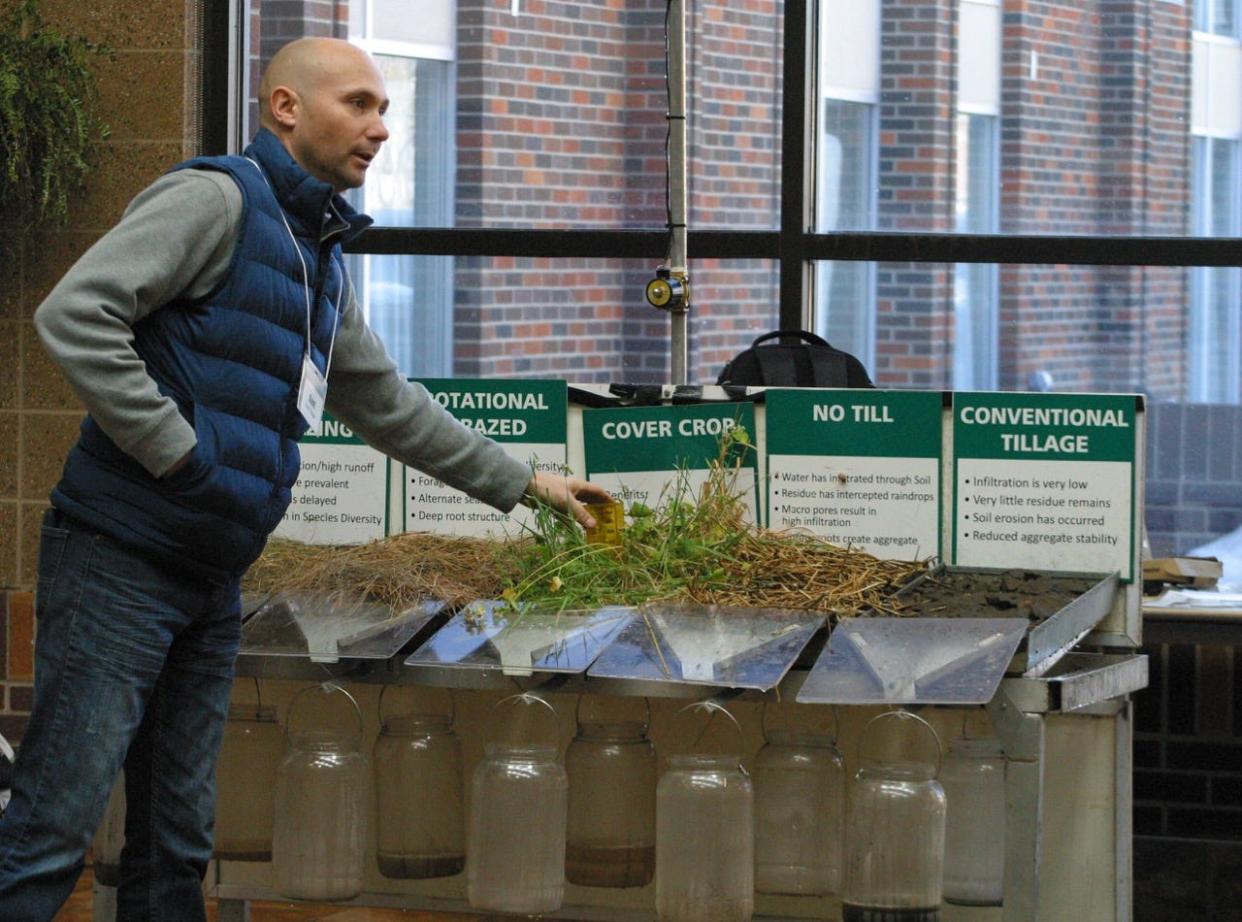 Kent Vlieger, soil health specialist for the Natural Resources Conservation Service, runs a rainfall simulator on a variety of soil practices to demonstrate water absorption at the Soil Health Conference in Aberdeen.