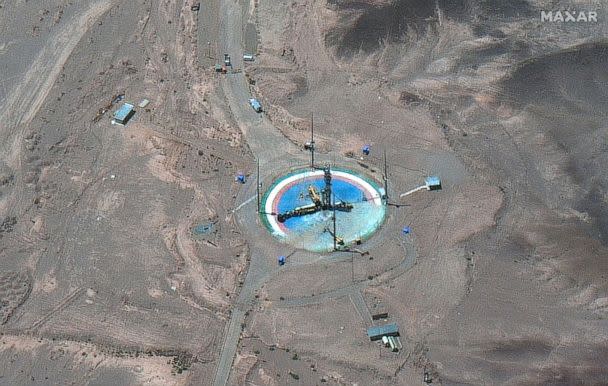 PHOTO: This satellite image from Maxar Technologies shows a rocket preparing to be erected at a launch pad at Imam Khomeini Space Center southeast of Semnan, Iran, on Tuesday, June 14, 2022. (Maxar Technologies via AP)