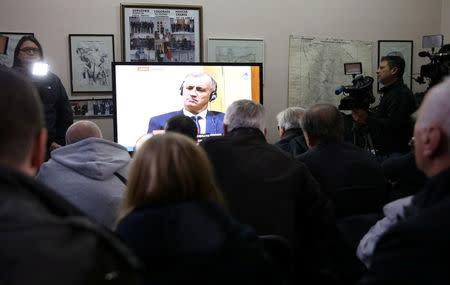 Union of former detainees watch a television broadcast of the appeal trial in the Hague, Netherlands, for six Bosnian Croat senior wartime officials accused of war crimes against Muslims in Bosnia's 1992-1995 war, in Mostar, Bosnia and Herzegovina November 29, 2017. REUTERS/Dado Ruvic