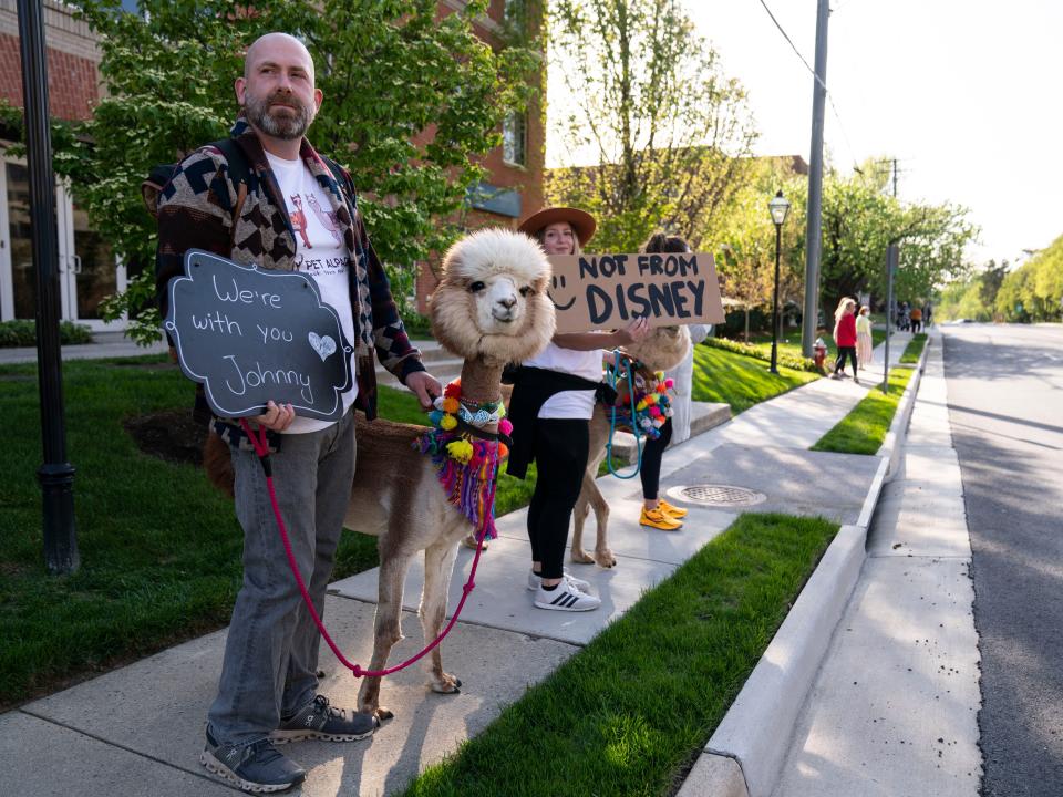 Andrea Diaz and two alpacas outside or courthouse for Johnny Depp trial