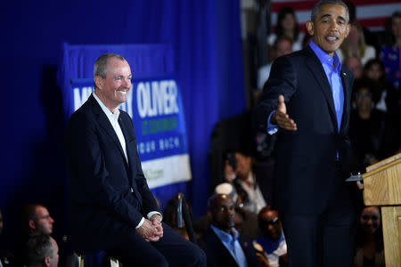 New Jersey Democratic Gubernatorial candidate Jim Murphy reacts as former President Barack Obama speaks during a rally in Newark, New Jersey U.S. October 19, 2017. REUTERS/Mark Makela