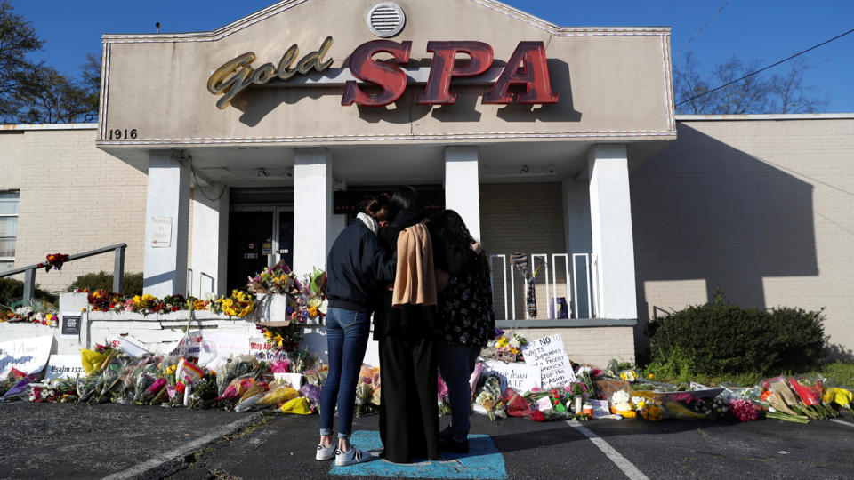 People embrace by a makeshift memorial outside the Gold Spa following the deadly shootings in Atlanta, Georgia, U.S. March 20, 2021. (Shannon Stapleton/Reuters)