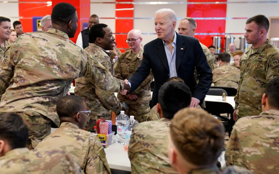 US President Joe Biden visits with members of the 82nd Airborne Division at the G2A Arena, Friday, March 25, 2022, in Jasionka, Poland.  - Evan Vucci/AP