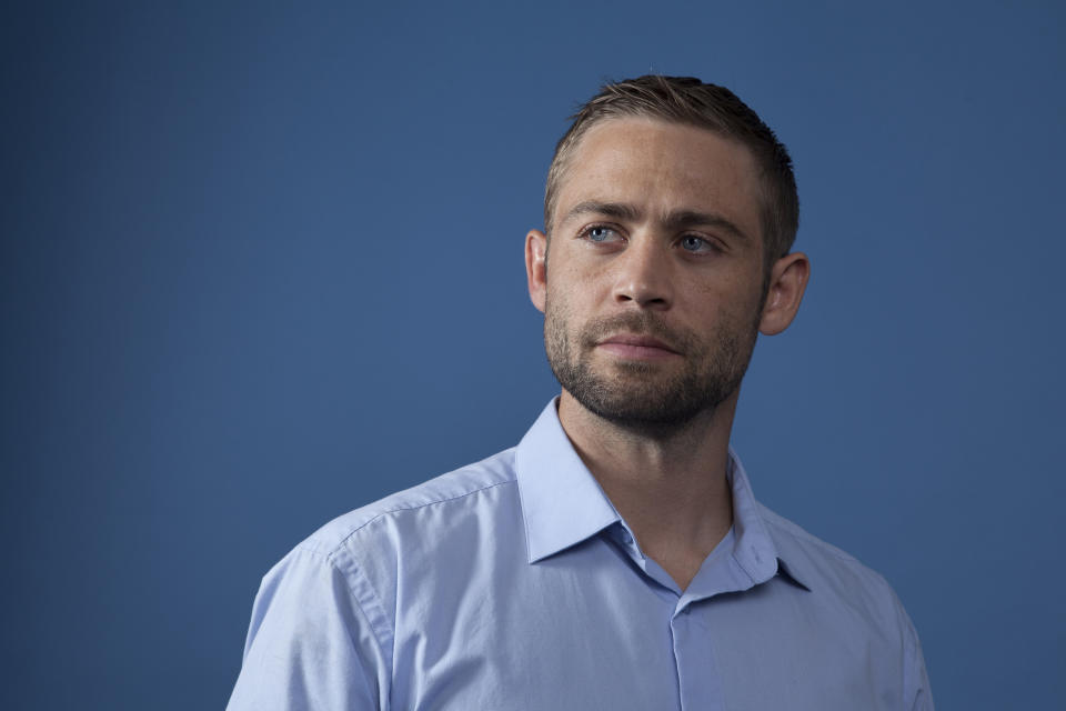 In this Wednesday, Aug. 8, 2018 photo, Cody Walker, Paul Walker's brother, poses for a portrait in Los Angeles, in promotion of the documentary film "I Am Paul Walker." Nearly five years after Paul Walker's death, his brothers, Caleb and Cody Walker, say they're open to playing his character again in the "Fast and Furious" franchise. (Photo by Rebecca Cabage/Invision/AP)