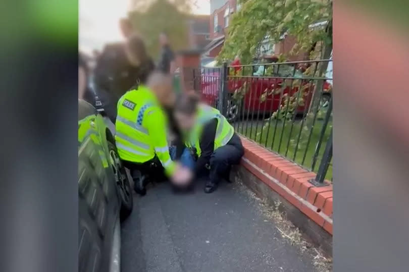 A boy of 15 is arrested by police on Briarfield Road in Burnage -Credit:Handout