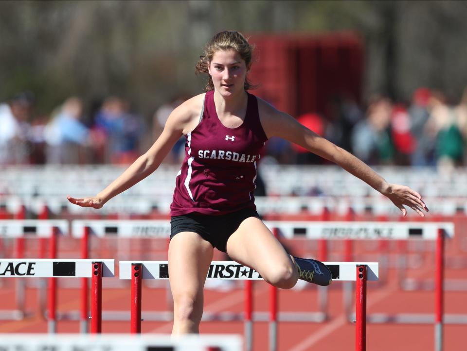 Scarsdale's Elizabeth Fine runs in the 100-meter hurdles at the 34th annual Red Raider Relay's at North Rockland High School in Thiells on Friday, April 22, 2022.