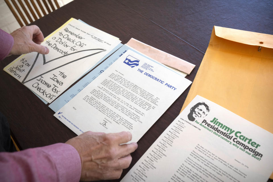 Richard Bender sorts through paperwork from a precinct caucus kit for the 1976 Iowa Democratic Party caucuses at his home, Thursday, Dec. 14, 2023 in Silver Spring, Md. In 1972 Bender, a then-25-year-old anti-Vietnam War activist, helped engineer the modern Iowa caucuses and did the statewide counting via a pair of phone lines. (AP Photo/Mark Schiefelbein)