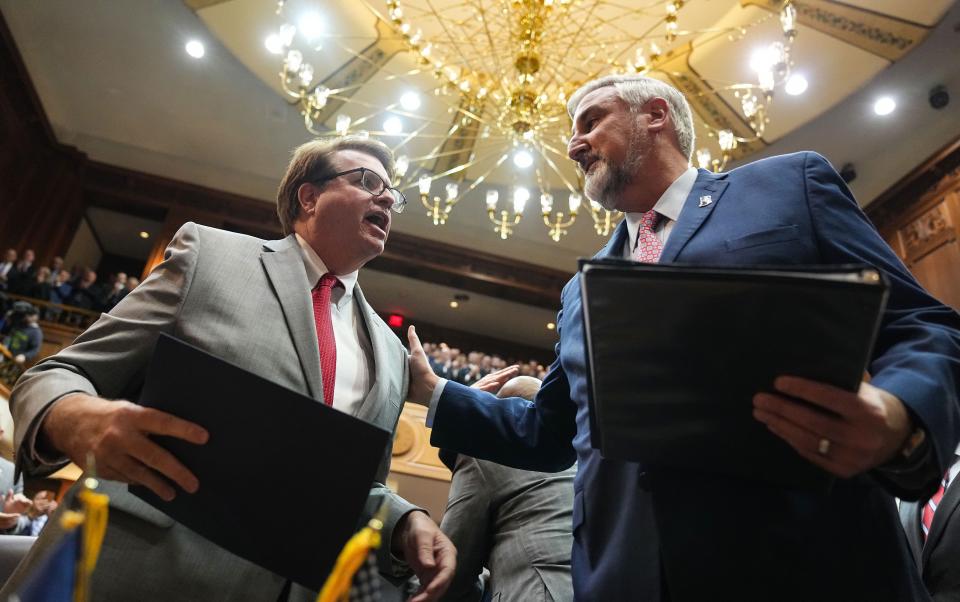 House Minority Leader Rep. Phil GiaQuinta, D-Fort Wayne, (left) shakes hands with Gov. Eric Holcomb during the State of the State address by Gov. Eric Holcomb on Tuesday, Jan. 10, 2023 at the Indiana State Capitol in Indianapolis.