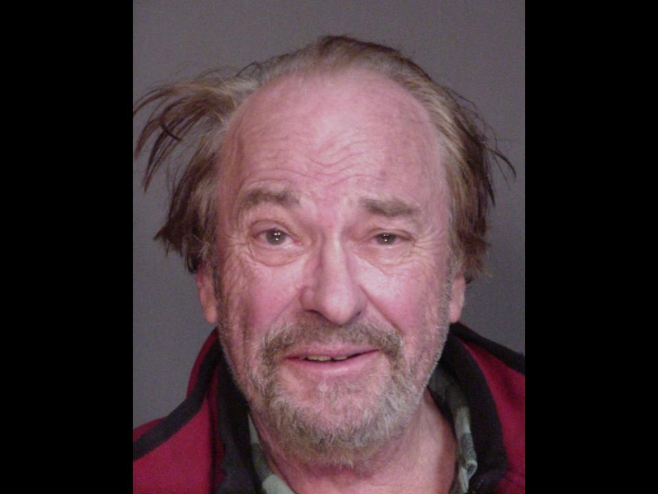 Rip Torn mugshot, actor after his arrest for driving while intoxicated, New York State Police photo on black