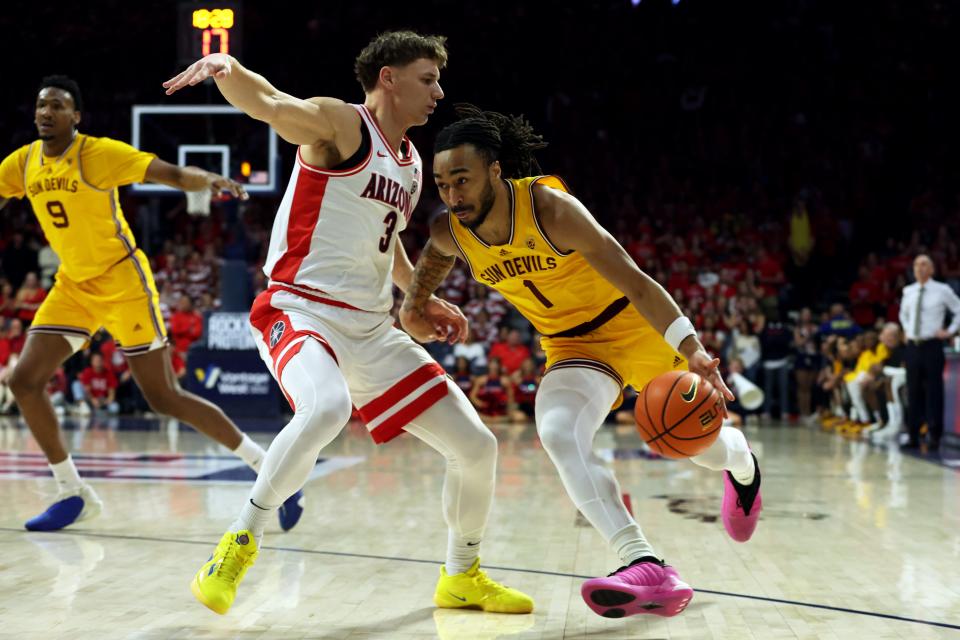 Arizona State Sun Devils guard Frankie Collins (1) drives to the net against Arizona Wildcats guard Pelle Larsson (3) during the first half at McKale Center in Tucson on Feb. 17, 2024.