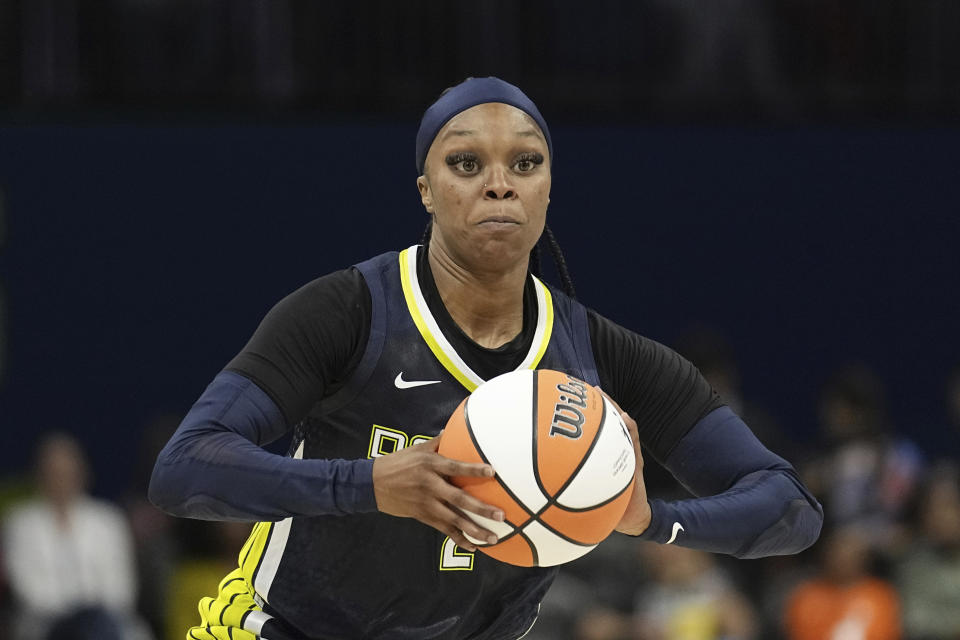 FILE - Dallas Wings guard Odyssey Sims works against the Phoenix Mercury during a WNBA basketball game, Wednesday, June 7, 2023, in Arlington, Texas. Seven years ago, Odyssey Sims was the hometown girl and co-star of the Dallas Wings, helping introduce the WNBA to a new Texas market. Five teams and the birth of a child later, Sims is on her second contract of the season in a return to the Wings, mature enough to call the younger version of herself a bad teammate while knowing she has to be a good one for the current faces of the franchise, Arike Ogunbowale and Satou Sabally. (AP Photo/Tony Gutierrez, File)