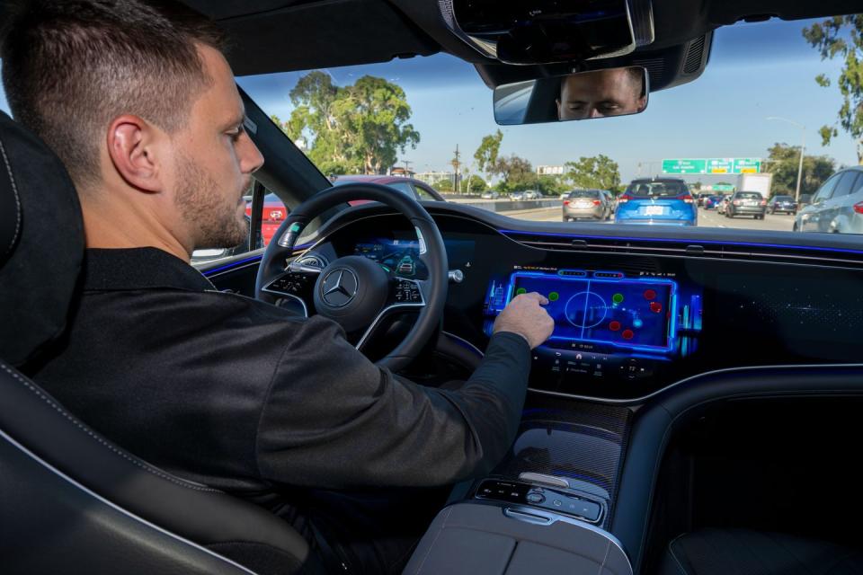 mercedes drive pilot driver playing shuffle puck