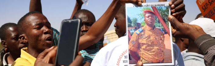 Demonstrators gathering in Ouagadougou to show support to the military hold a picture of Paul-Henry Sandaogo Damiba the leader of Burkina Faso's coup - 25 January 2022