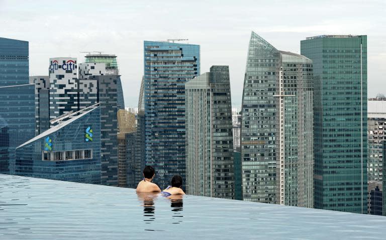 Singapore city skyline from the rooftop pool of the Marina Bay Sands resort hotel on May 20, 2014