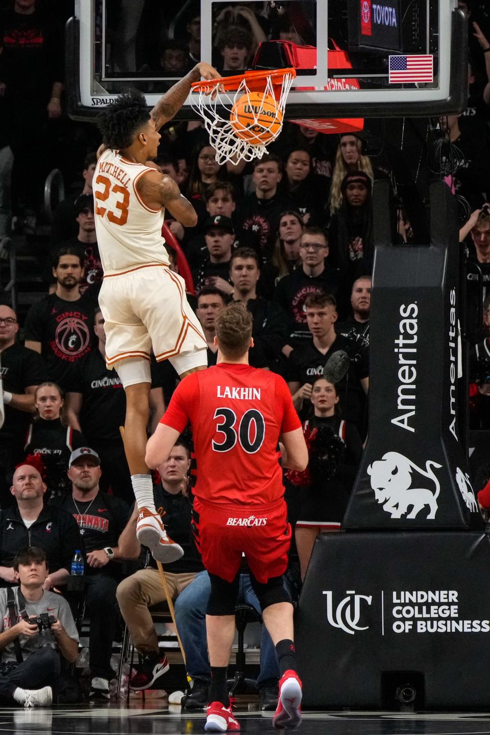 Texas Longhorns forward Dillon Mitchell (23) breaks away to dunk the ball in the second half  of their game with the Bearcats Jan. 9. Texas won 74-73 on a jumper by Max Abmas in the final seconds.