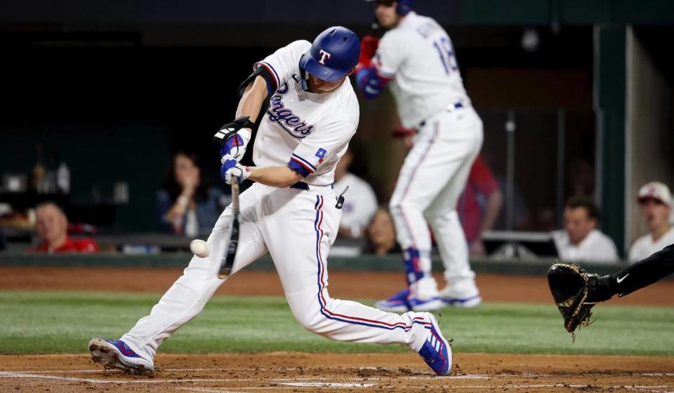 Texas Rangers shortstop Corey Seager hits a home run in the first inning against the Baltimore Orioles in Game 3 of the ALDS on Tuesday, October 10, 2023, at Globe Life Field in Arlington.