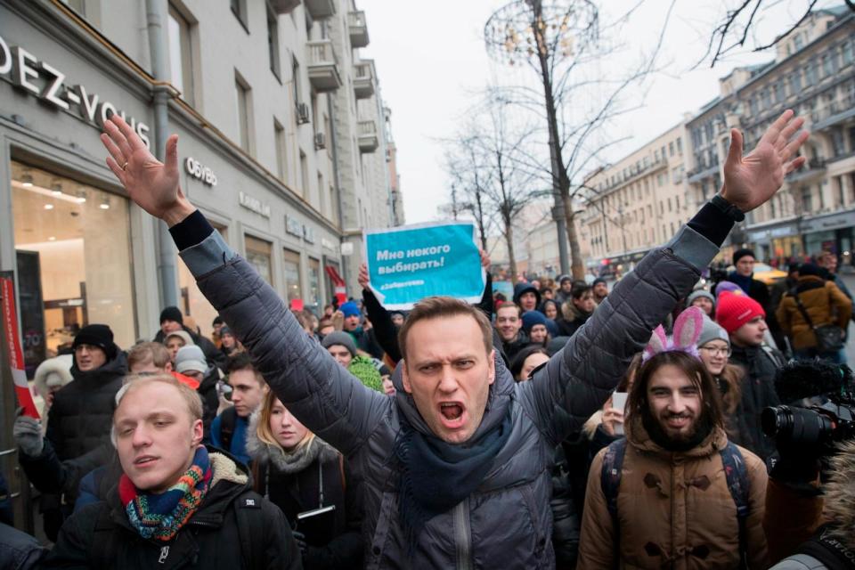 PHOTO: Russian opposition leader Alexei Navalny, center, attends a rally in Moscow, Jan. 28, 2018. (Evgeny Feldman/AP)