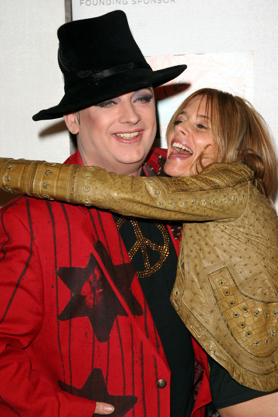 Rosanna Arquette (R) greets Boy George at the premiere of "All We Are Saying" at the Tribeca Film Festival in New York on April 22, 2005.