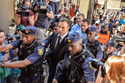 Oscar Pistorius arrives at the High Court in Pretoria on October 21, 2014 (AFP Photo/Mujahid Safodien)