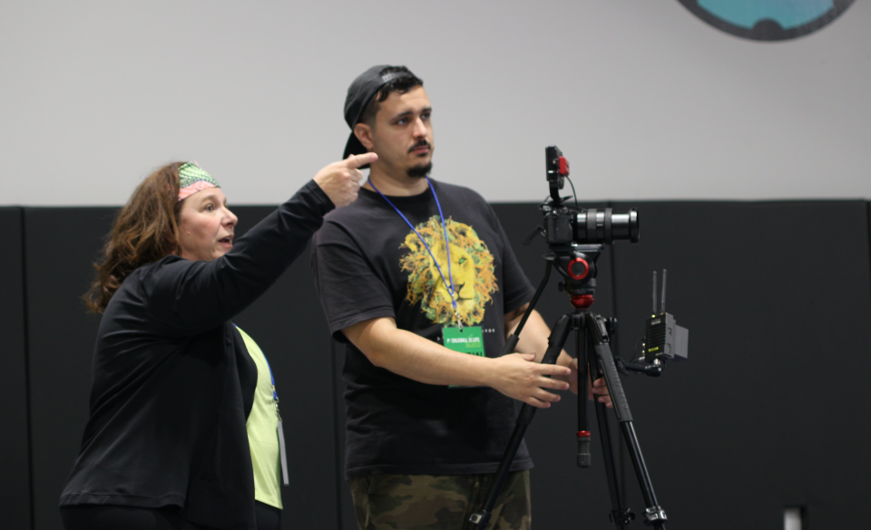 Carol Ann DeMarco, left, directs the next shot with Ethan de Aguiar, right, on set of "Pickleball is Life: Dill With It!"