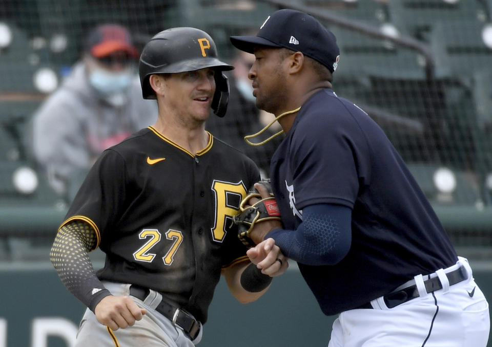 Pirates second baseman Kevin Newman is caught stealing by Tigers third baseman Jonathan Schoop Saturday, March 20, 2021, at Publix Field at Joker Marchant Stadium in Lakeland, Fla. (Matt Freed /Pittsburgh Post-Gazette via AP)