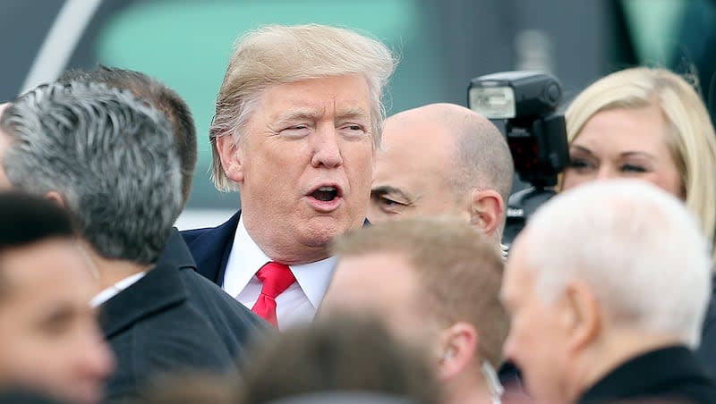 President Donald Trump makes his way to his limousine at Roland R. Wright Air National Guard Base at the Salt Lake City International Airport in Salt Lake City on Monday, Dec. 4, 2017.