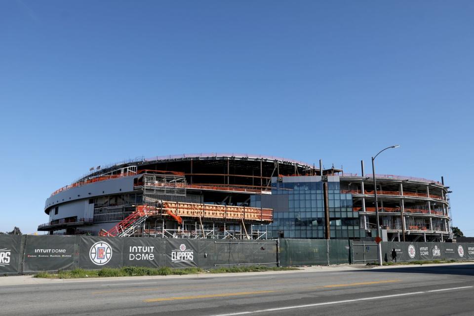 The Intuit Dome is seen from a street-level view.