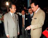 FILE PHOTO: Malaysian Prime Minister Mahathir Mohamad chats with Deputy Prime Minister Anwar Ibrahim during a function in Kuala Lumpur
