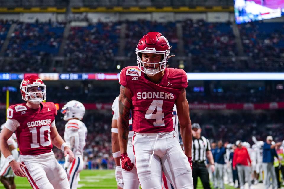 Dec 28, 2023; San Antonio, TX, USA; Oklahoma Sooners wide receiver Nic Anderson (4) celebrates a touchdown catch in the first half against the Arizona Wildcats at Alamodome.