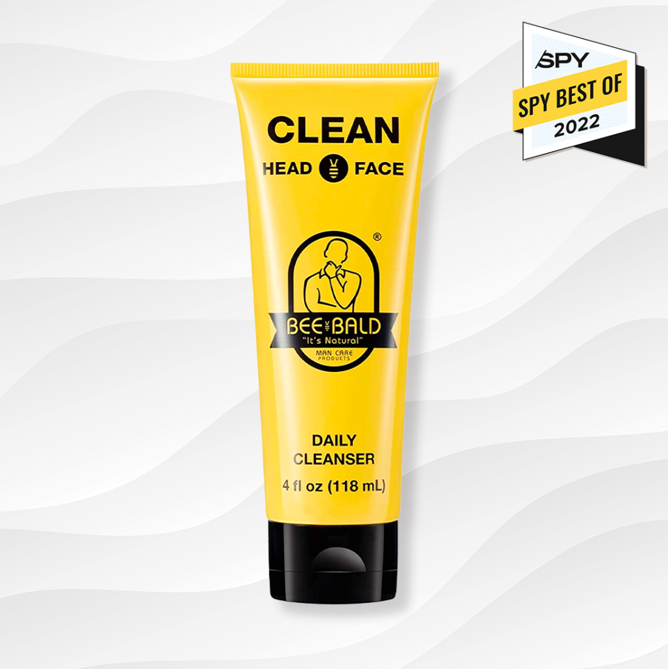 the bee bald clean daily cleanser for bald guys against a white wavy background