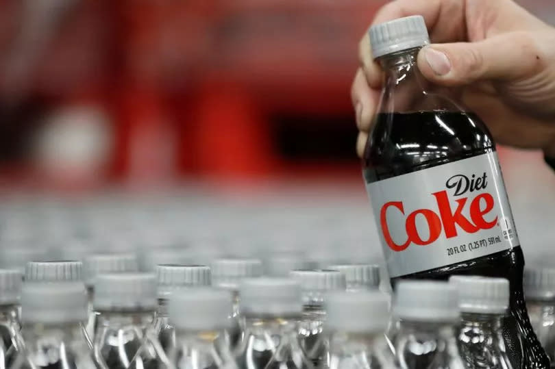 A bottle of Diet Coke is pulled for a quality control test at a Coco-Cola bottling plant on February 10, 2017 in Salt Lake City, Utah.