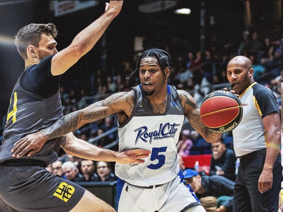 Nighthawks guard Ahmed Hill, right, scored a team-high 23 points in a 89-83 win over the Hamilton Honey Badgers on Sunday in Guelph, Ont. (@CEBLeague/Twitter - image credit)