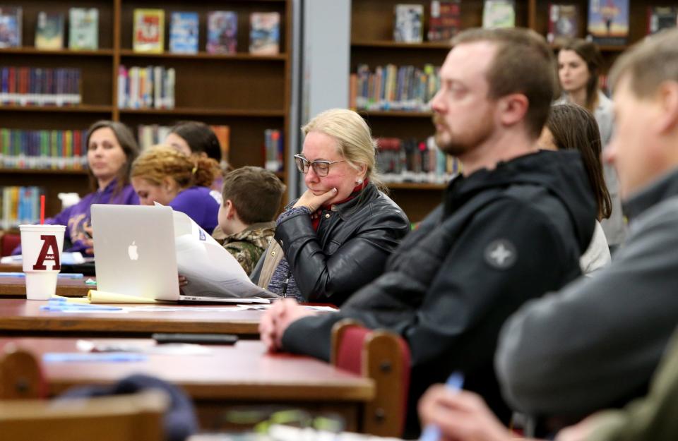 NEA-South Bend President Linda Lucy, center, takes in details Wednesday, Feb. 8, 2023, at the information session for the South Bend school district’s long-range facilities master plan at Clay International Academy in South Bend.