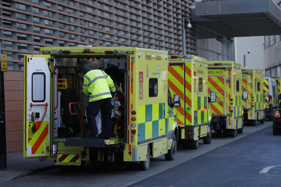 A patient arrives in an ambulance outside the Royal London Hospital in east London, Monday, Jan. 25, 2021, during England's third national lockdown since the coronavirus outbreak began. The U.K. is under an indefinite national lockdown to curb the spread of the new variant, with nonessential shops, gyms and hairdressers closed, most people working from home and schools largely offering remote learning. (AP Photo/Matt Dunham)
