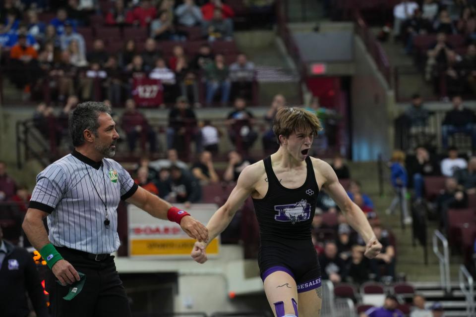 DeSales’ David McClelland celebrates his win against  Louisville’s Pablo Castro during the OHSAA wrestling finals at the Schottenstein Center in Columbus, Ohio, on Sunday, March 13, 2022. McClelland won the 132 pound weight class for Division II. 