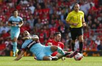 Football - Liverpool v West Ham United - Barclays Premier League - Anfield - 29/8/15 West Ham's Dimitri Payet in action with Liverpool's Danny Ings Reuters / Eddie Keogh Livepic