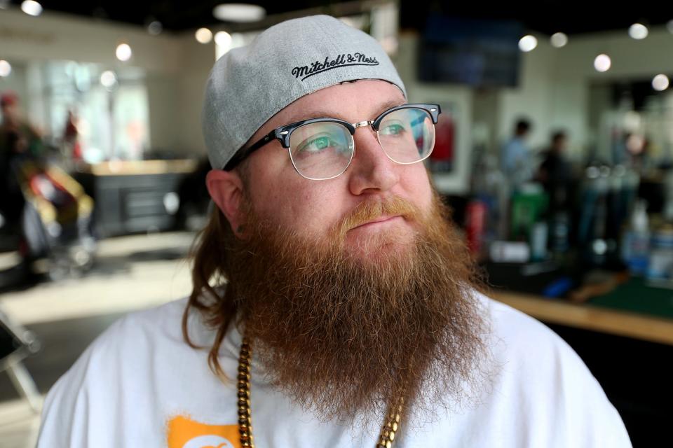 Steve Wasiewski, barber at The Bearded Man Barbershop in Dover, shows off his own beard.