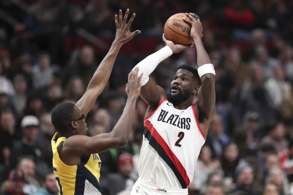 Portland Trail Blazers center Deandre Ayton (2) shoots over Indiana Pacers forward Jalen Smith (25) during the first half of an NBA basketball game Friday, Jan. 19, 2024, in Portland, Ore. (AP Photo/Amanda Loman)