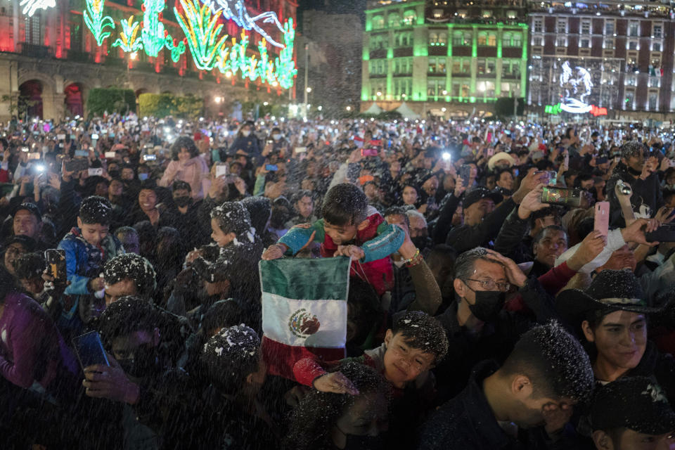 People attend the Independence Day celebrations in Mexico City's main square the Zocalo, Thursday, Sept. 15, 2022. (AP Photo/Eduardo Verdugo)