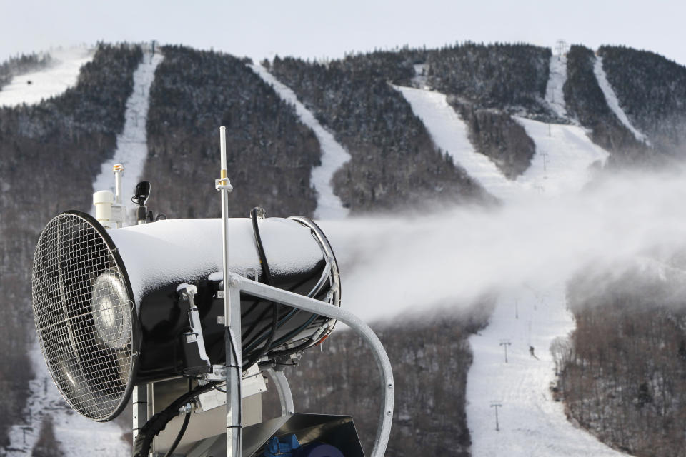 This Nov. 15, 2012 file photo shows a snow gun making fresh snow at the Stowe resort in Stowe, Vt. The ground might be bare, but ski areas across the Northeast are making big investments in high-efficiency snowmaking so they can open more terrain earlier and longer. (AP Photo/Toby Talbot)