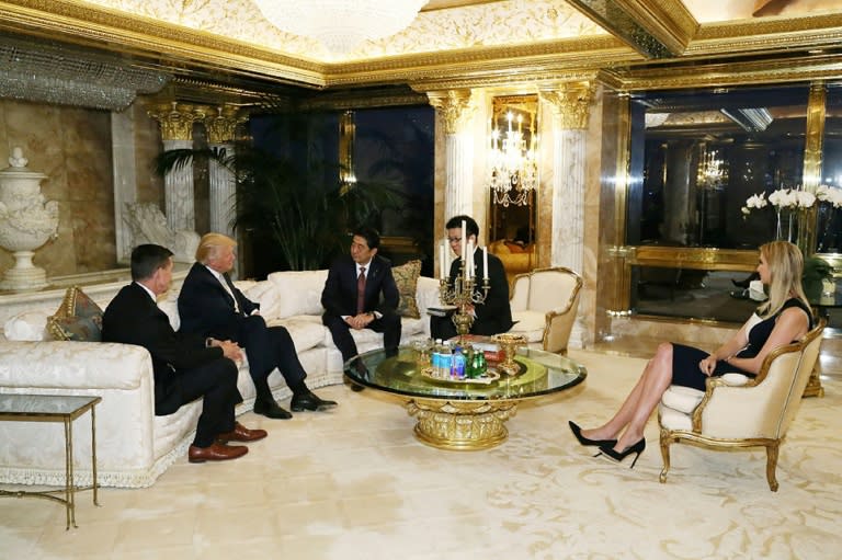 Japan's Prime Minister Shinzo Abe (centre) meets US President-elect Donald Trump (2nd left) in New York, with Trump's daughter Ivanka Trump present