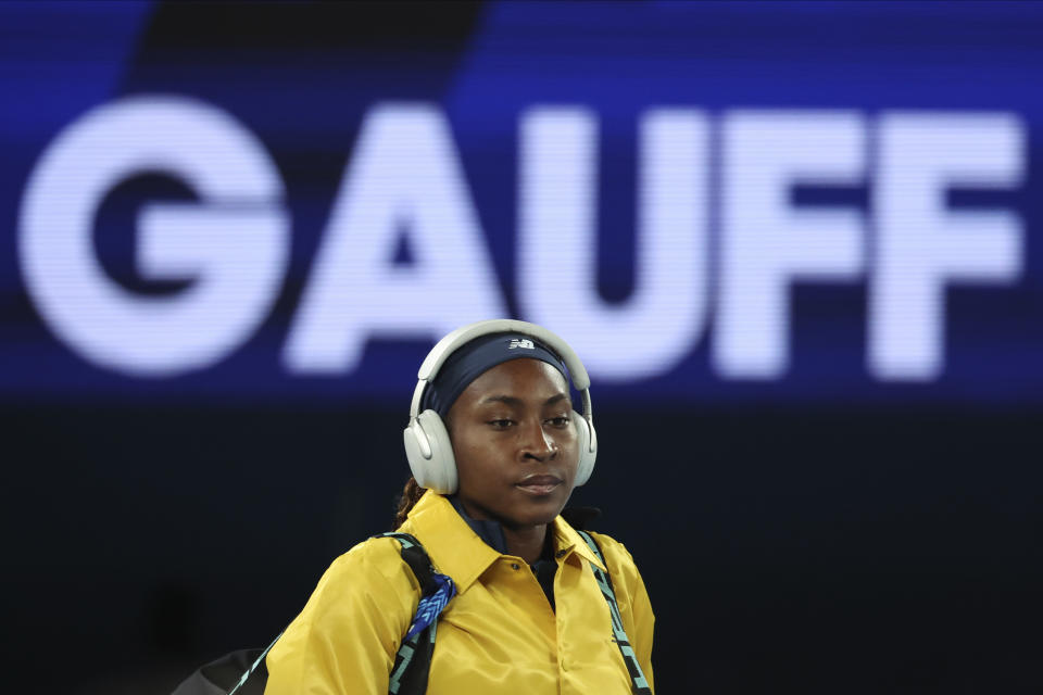 Coco Gauff of the U.S. walks onto Rod Laver Arena ahead of her semifinal against Aryna Sabalenka of Belarus at the Australian Open tennis championships at Melbourne Park, Melbourne, Australia, Thursday, Jan. 25, 2024. (AP Photo/Asanka Brendon Ratnayake)