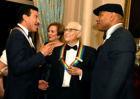 2017 Kennedy Center Honorees singer Lionel Ritchie (L), TV writer Norman Lear (C) and Rapper LL Cool J chat among themselves at the conclusion of a gala dinner at the U.S. State Department, in Washington, U.S., December 2, 2017. REUTERS/Mike Theiler