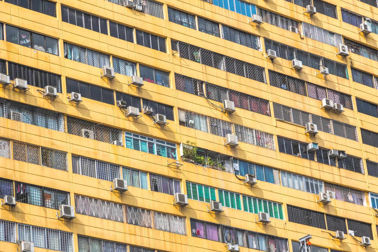 Facade of a huge tower block, People's Park Complex in Chinatown district, Singapore, illustrating a story on enhanced ComLink aid.